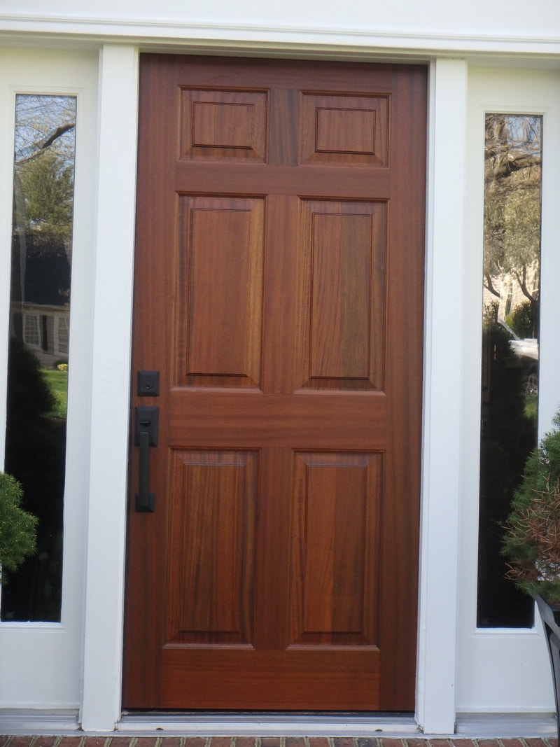 Mahogny entry door installed in existing frame
